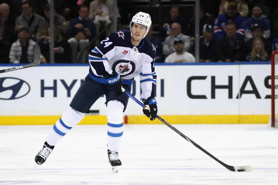 Winnipeg Jets' Haydn Fleury handles the puck