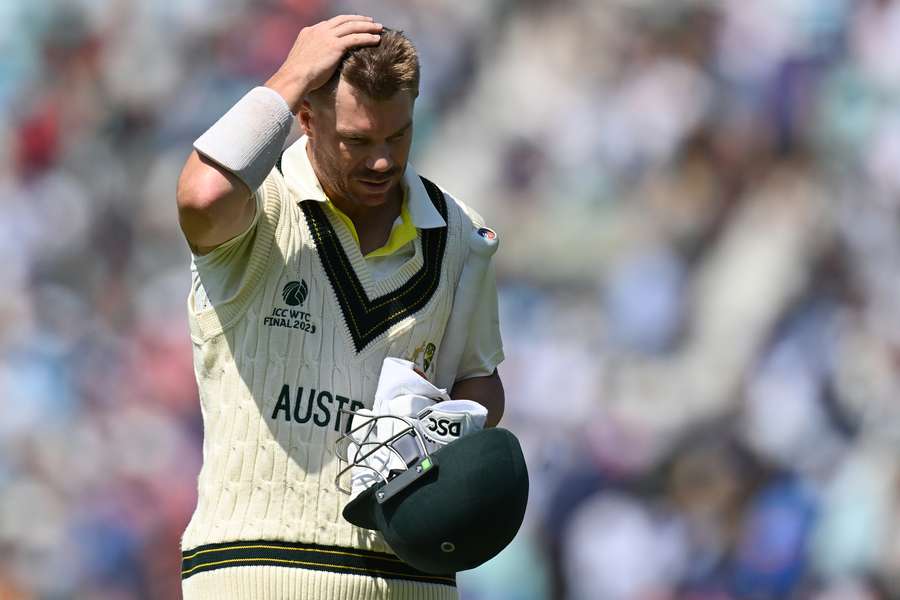 Australia's David Warner walks back to the pavilion after losing his wicket for one run during play on day 3 of the ICC World Test Championship cricket final match between Australia and India at The Oval