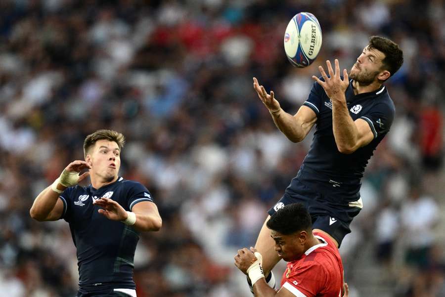 Scotland's full-back Blair Kinghorn (R) jumps for the ball during the France 2023 Rugby World Cup Pool B match between Scotland and Tonga