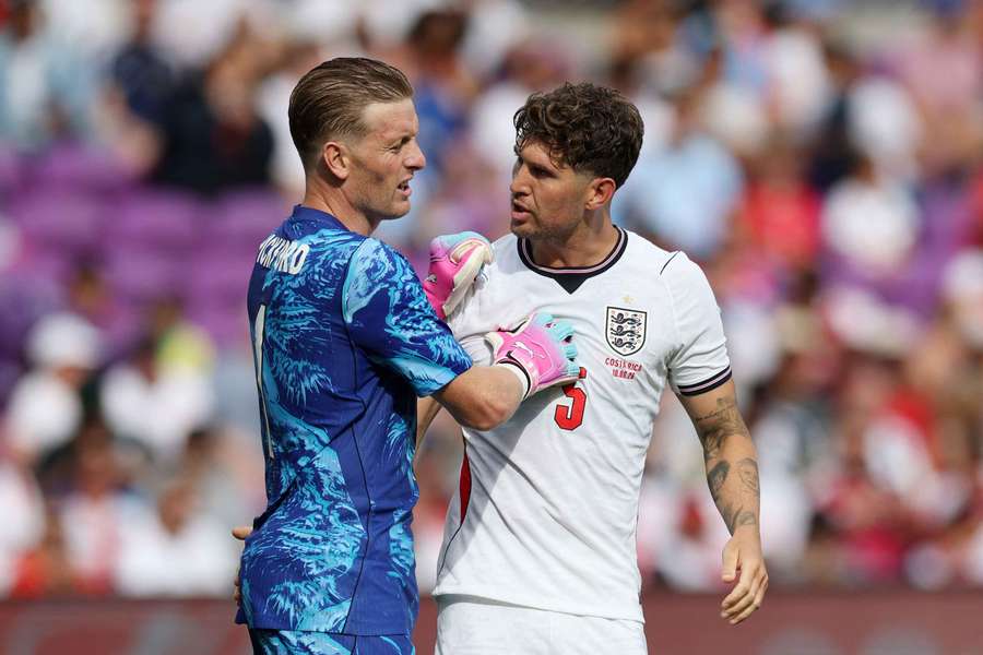 Jordan Pickford and John Stones in action for England Jordan Pickford and John Stones in action for England
