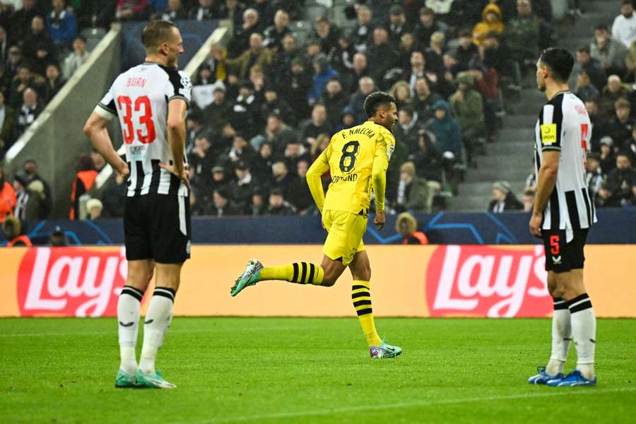 Felix Nmecha celebrates after giving Dortmund the lead against Newcastle at St James' Park