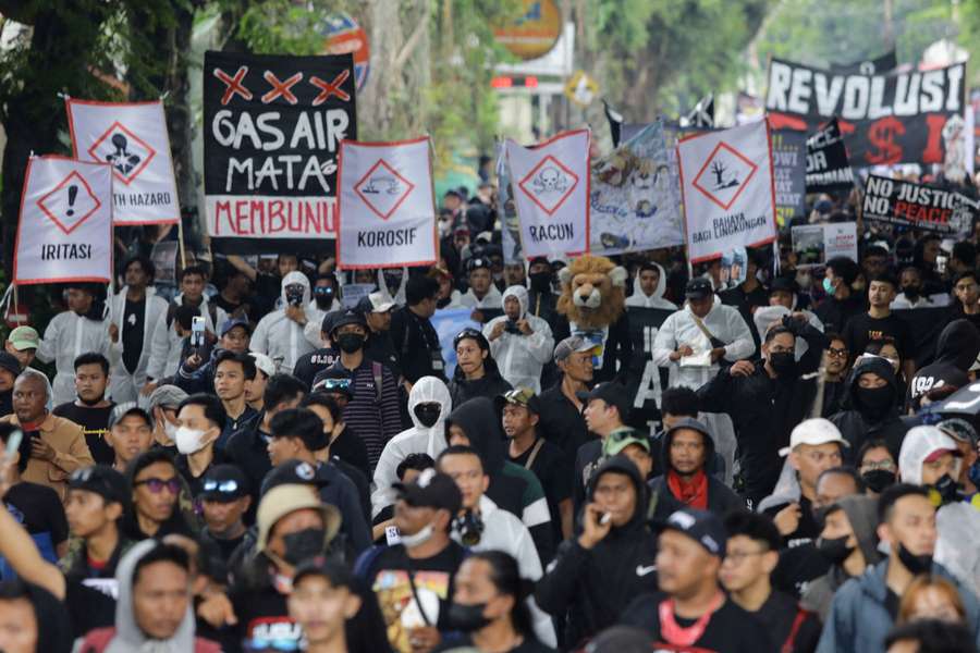 Indonesians march for justice after deadly soccer stampede