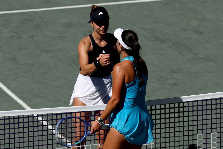 Jovic and Pegula shake hands at the net Jovic and Pegula shake hands at the net