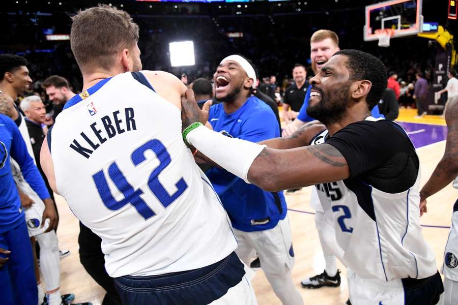 Maxi Kleber (L) and Kyrie Irving celebrate their late win