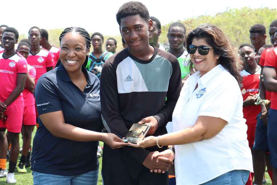 Samuel Harvey receives an award at a youth tournament