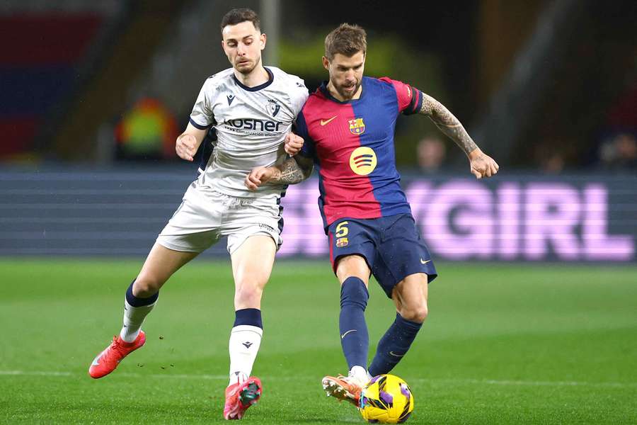 Inigo Martinez, right, in action for Barcelona