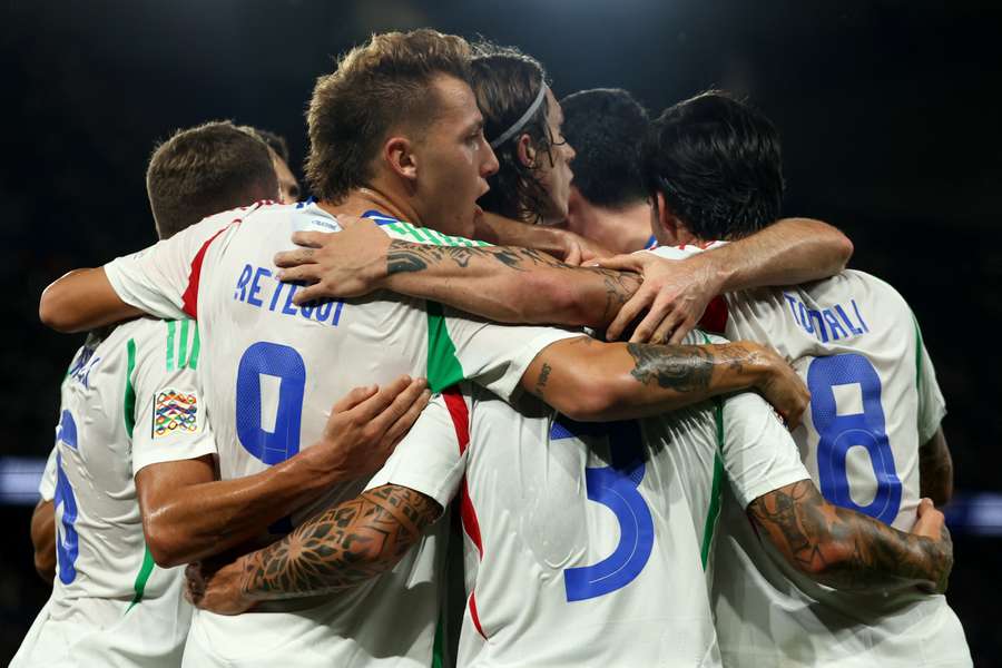 Italy players celebrate after scoring against France