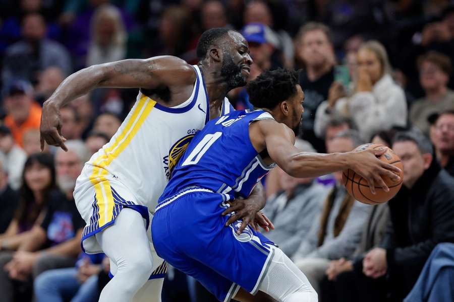 Sacramento Kings guard Malik Monk is fouled by Golden State Warriors forward Draymond Green during the fourth quarter at Golden 1 Centre