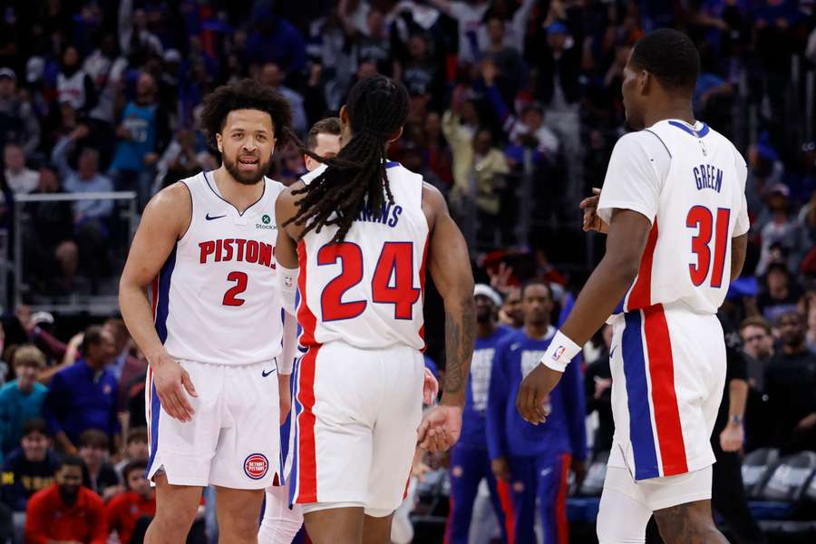 Detroit Pistons guard Daniss Jenkins receives congratulations from guard Cade Cunningham against the Orlando Magic