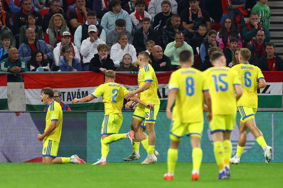 Ukraine's Danylo Sikan celebrates scoring with teammates Ukraine's Danylo Sikan celebrates scoring with teammates