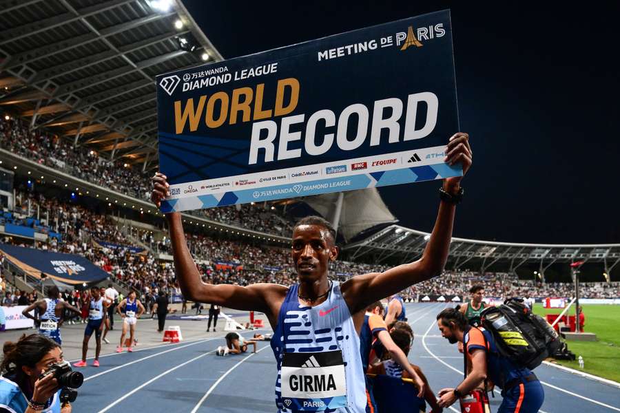 Lamecha Girma celebrates after breaking a world record in the 3,000m steeplechase