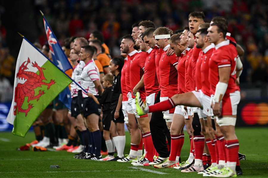 Wales' players line up for the national anthem