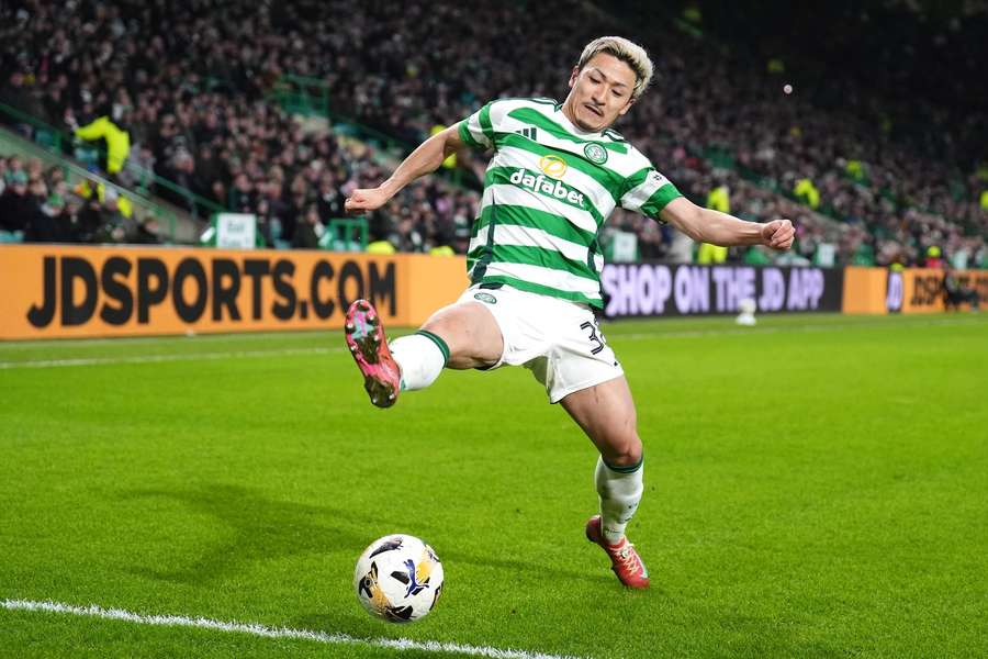 Celtic's Daizen Maeda attempts to keep the ball in play