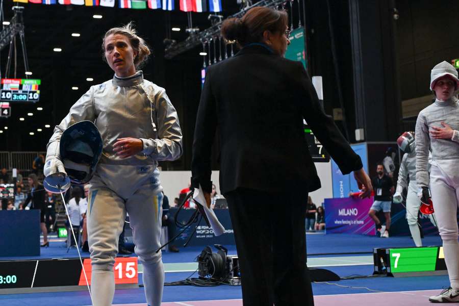 Ukraine's Olha Kharlan (L) walks away after refusing to shake hands with Russia's Anna Smirnova, who was competing as a neutral athlete