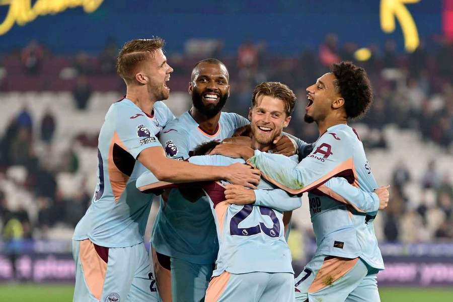 Brentford's Mathias Jensen is mobbed by his team mates after scoring the Bees' second goal at West Ham Brentford's Mathias Jensen is mobbed by his team mates after scoring the Bees' second goal at West Ham