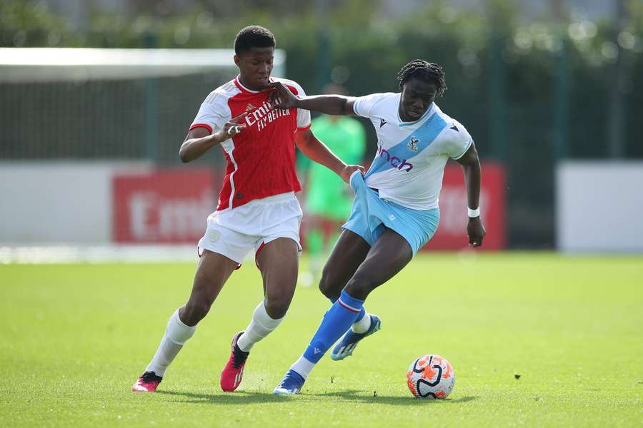 Manchester United signed Chido Obi-Martin (L) from Arsenal 