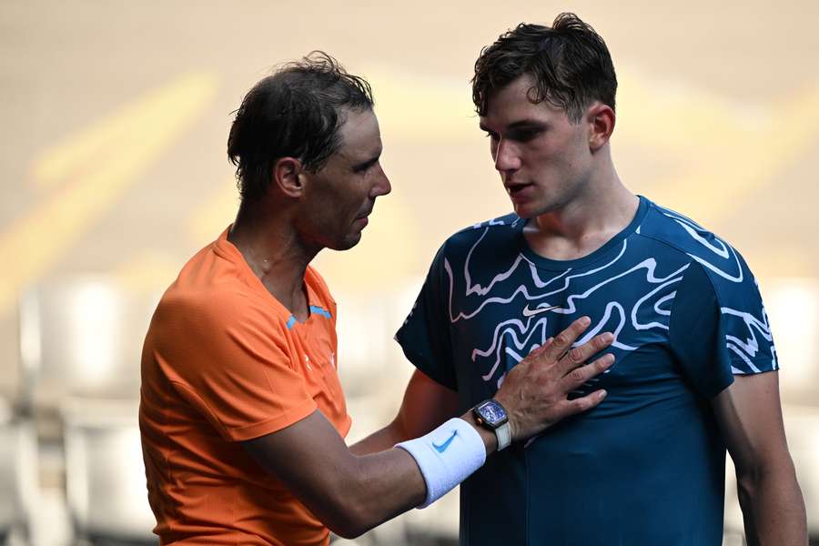 Nadal (L) consoles Draper after his first round defeat