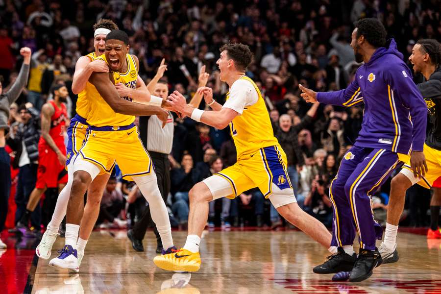 Rui Hachimura of the Los Angeles Lakers celebrates after making the game-winning three-pointer in an NBA victory over the Toronto Raptors
