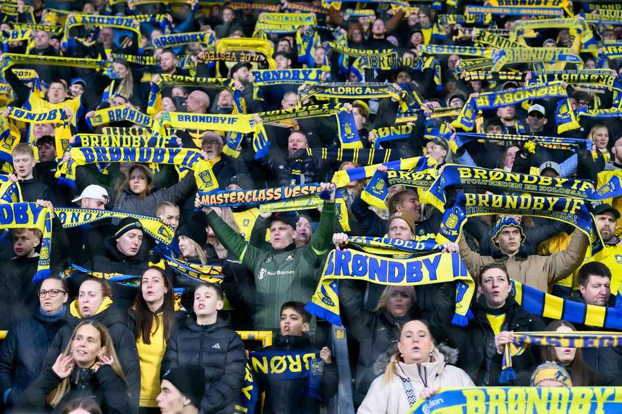 The Brondby fans celebrate their late win at Viborg
