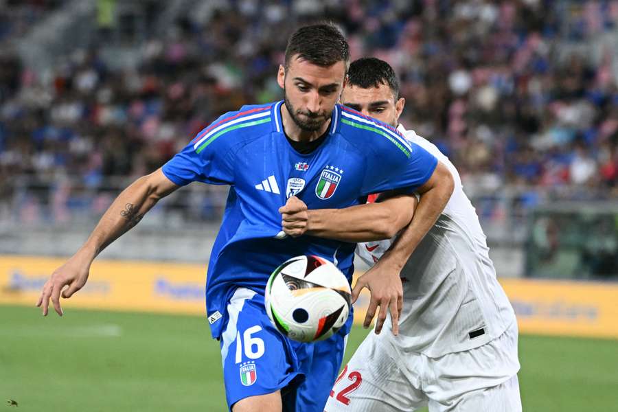 Italy's Bryan Cristante fights for the ball with Turkey's Kaan Ayhan