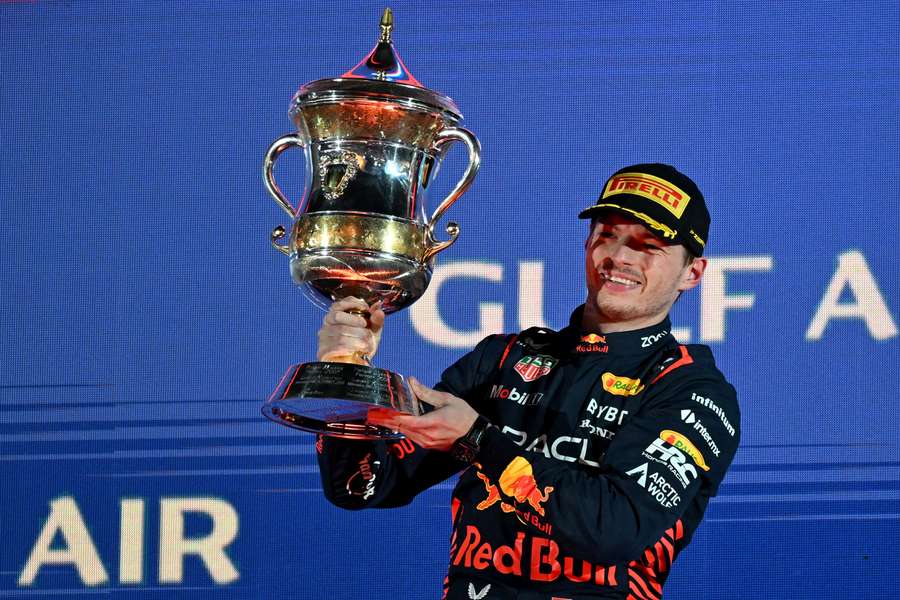 Red Bull's Dutch driver Max Verstappen celebrates with the winner's trophy on the podium