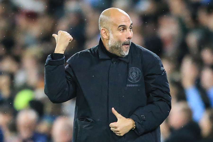 Pep Guardiola celebrates after Haaland scored his team's second goal during the Champions League match between Man City and FC Copenhagen