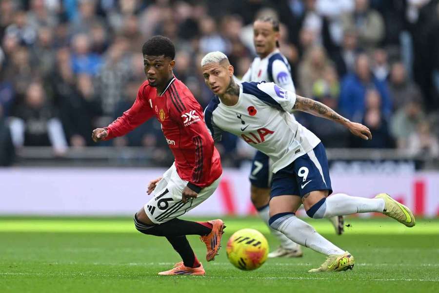 Manchester United's Amad Diallo holds off Tottenham Hotspur's Richarlison