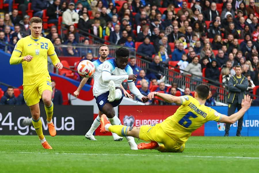 Bukayo Saka takes aim and scores England's second goal of the game