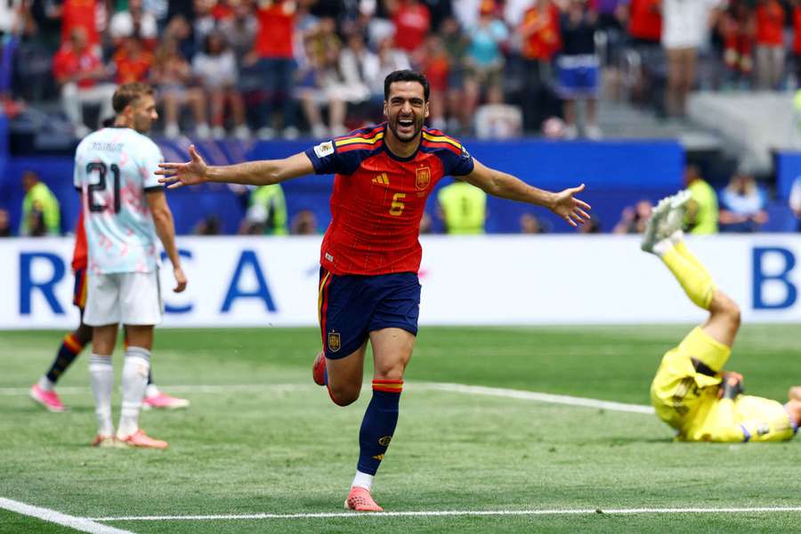Mikel Merino celebrates scoring Spain's second goal against Belgium