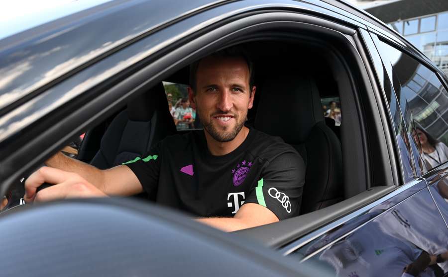 Bayern Munich's English forward #09 Harry Kane sits in his new car during a sponsoring event at the German car manufacturer Audi