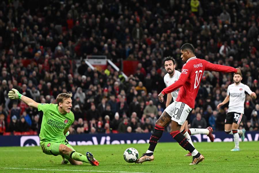 Manchester United's English striker Marcus Rashford scores their second goal past Charlton's Australian goalkeeper Ashley Maynard-Brewer