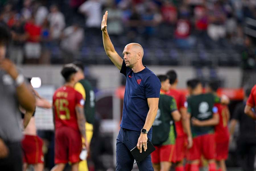 Gregg Berhalter waves to fans after Copa América exit