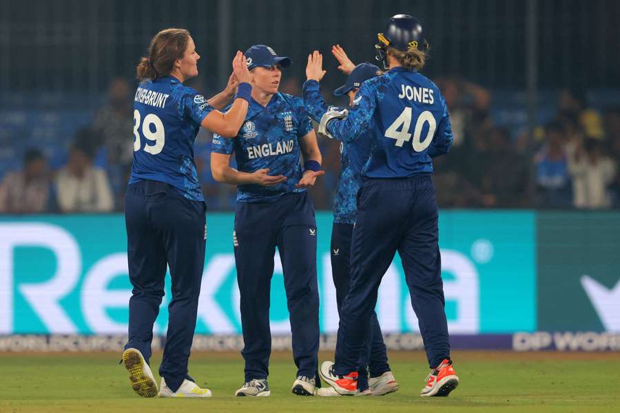 Nat Sciver-Brunt of England celebrates with team mates after taking the wicket of Richa Ghosh Nat Sciver-Brunt of England celebrates with team mates after taking the wicket of Richa Ghosh