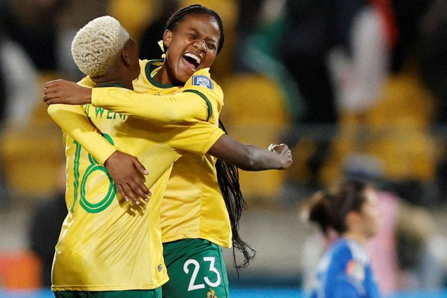 South Africa's Wendy Shongwe and Sibulele Cecilia Holweni embrace after the final whistle