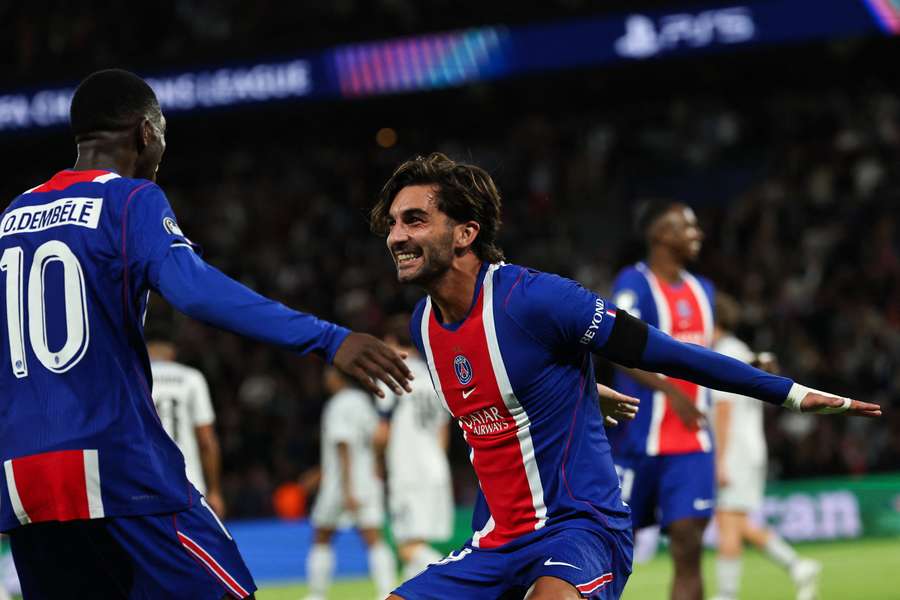 Torres celebrates with Dembele Torres celebrates with Dembele