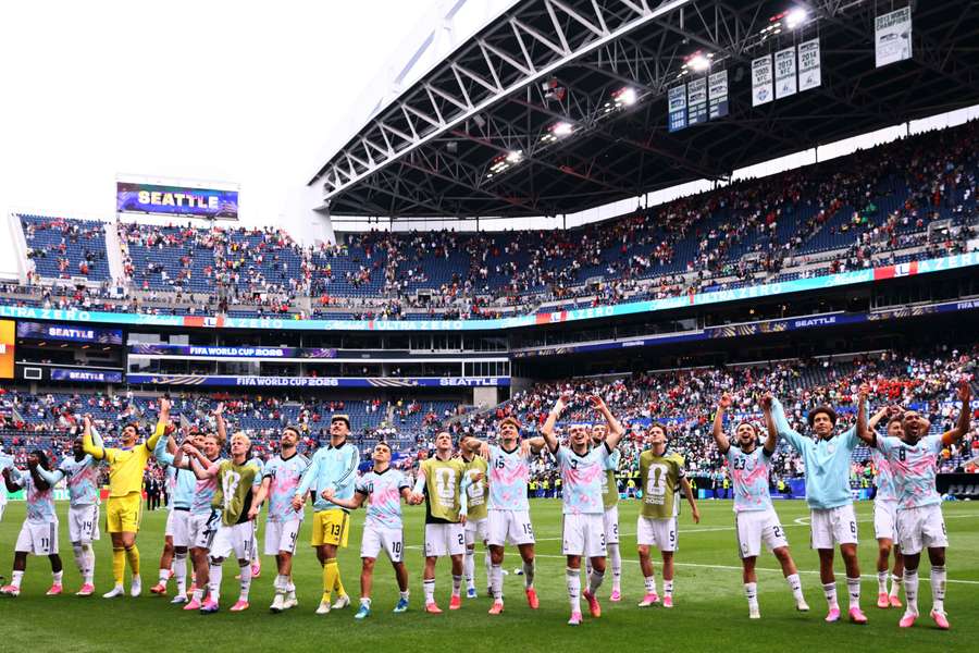 Belgium players celebrate after the match as they qualify for the Round of 16 stage of the World Cup. Belgium players celebrate after the match as they qualify for the Round of 16 stage of the World Cup.