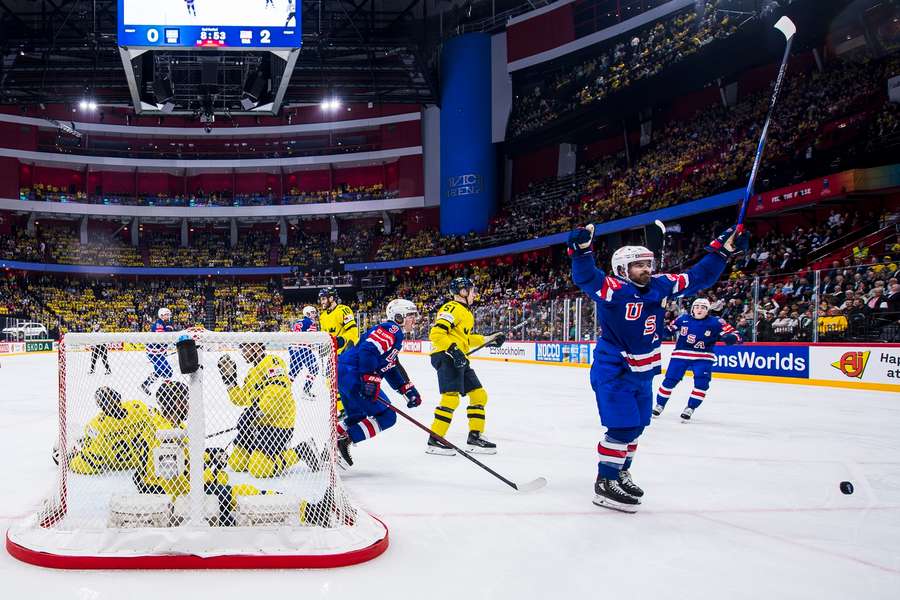 Conor Garland celebrates making the score 3-0 in the second period