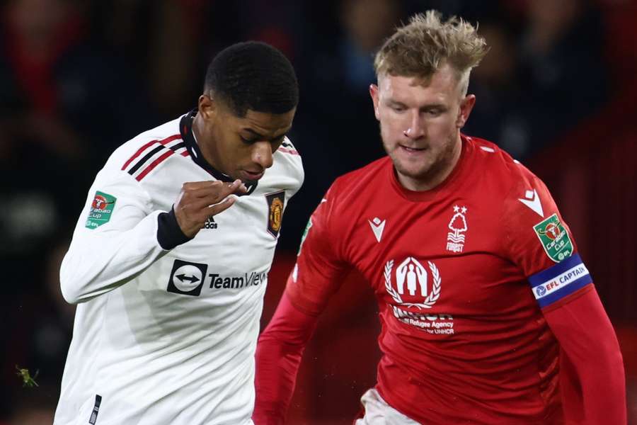 Marcus Rashford runs with the ball to score his team first goal during the English League Cup semi-final first-leg 