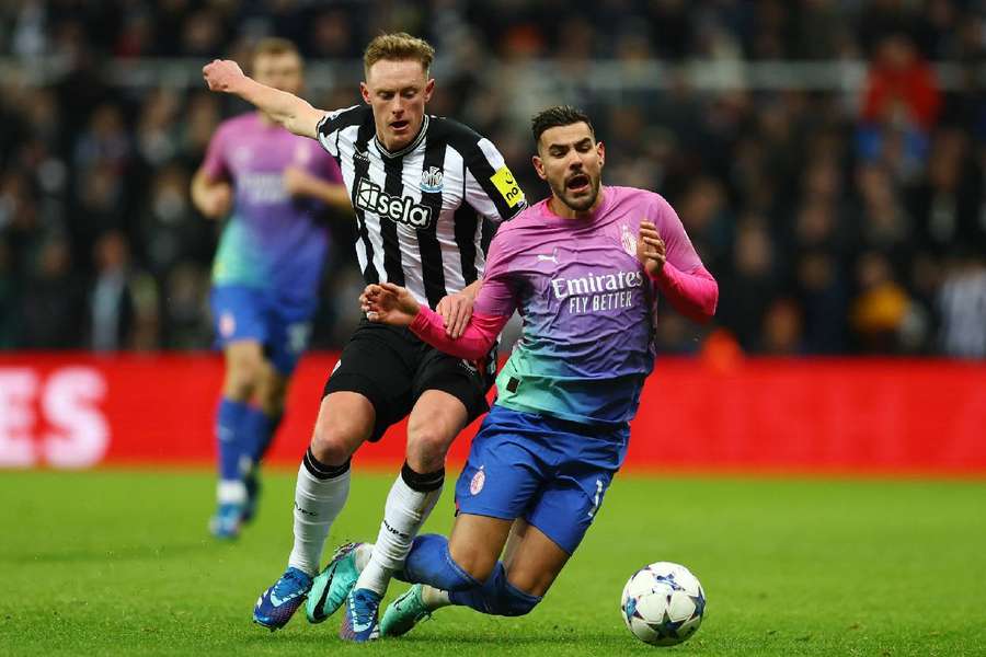 Newcastle United's Sean Longstaff in action with AC Milan's Theo Hernandez