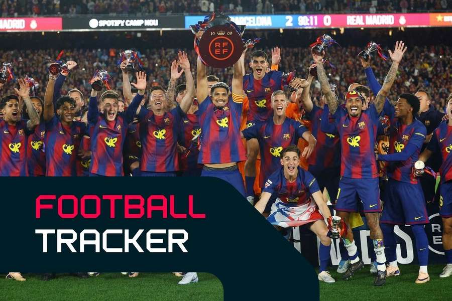 Barcelona's Ronald Araujo lifts the trophy as he celebrates with teammates after winning the LaLiga Barcelona's Ronald Araujo lifts the trophy as he celebrates with teammates after winning the LaLiga