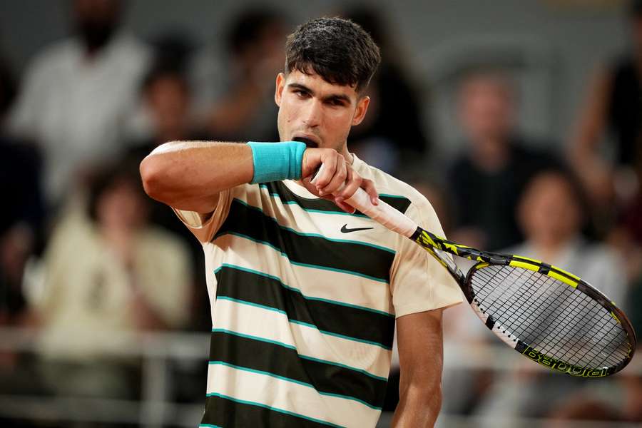 Carlos Alcaraz reacts during his men's singles match against Damir Dzumhur's