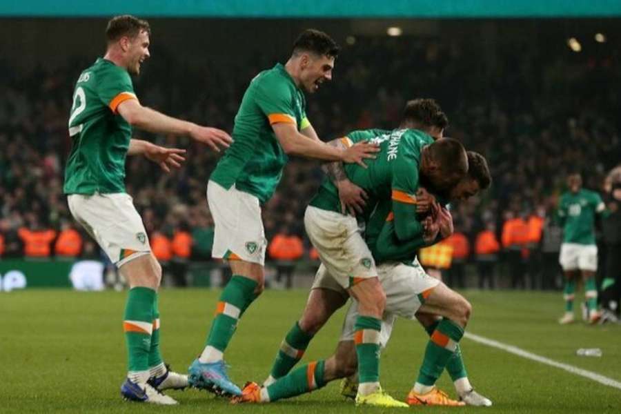 Ireland celebrate as they win their first points in Group B