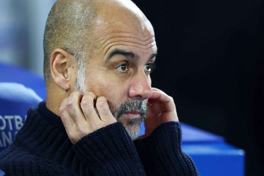 Pep Guardiola reacts ahead of Man City's match against Brighton