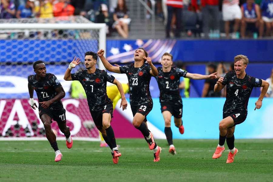 Canada celebrate their late winner