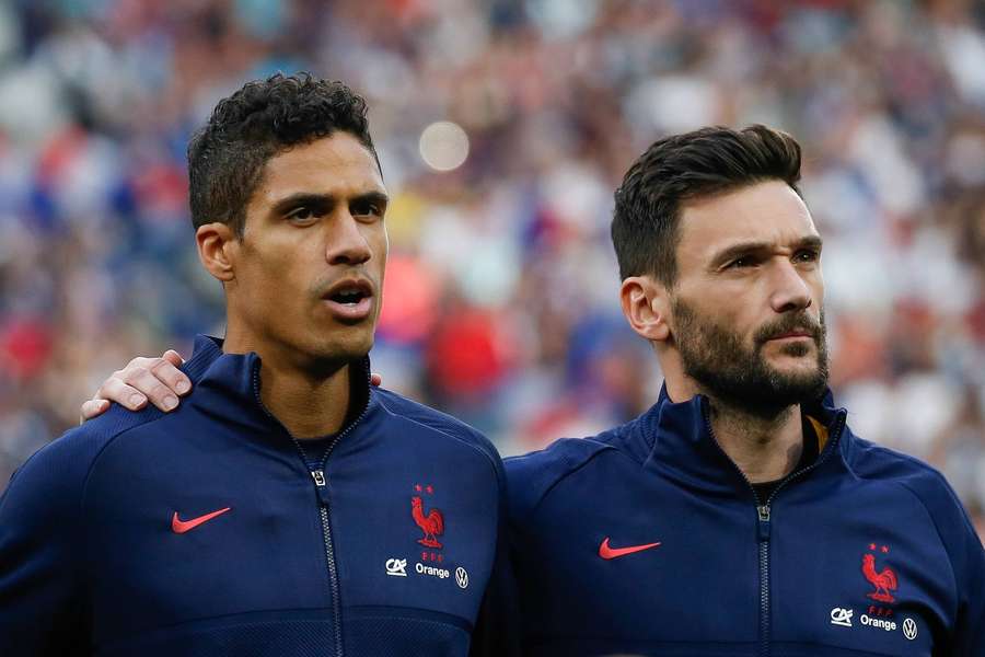 France's defender Rafael Varane and goalkeeper Hugo Lloris (R)