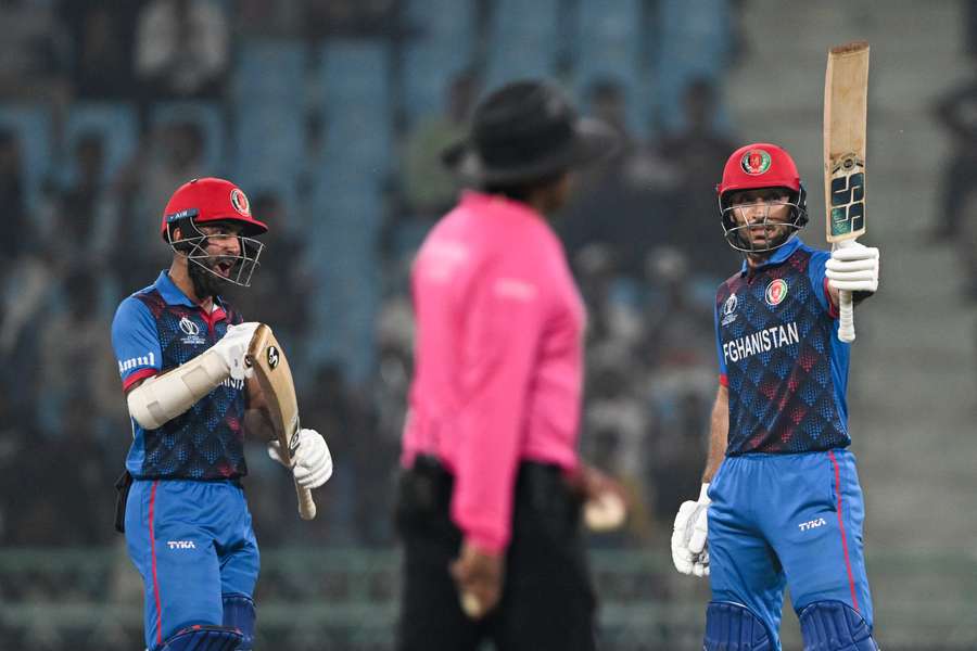 Afghanistan's Rahmat Shah (right) celebrates his half-century against the Dutch on Friday