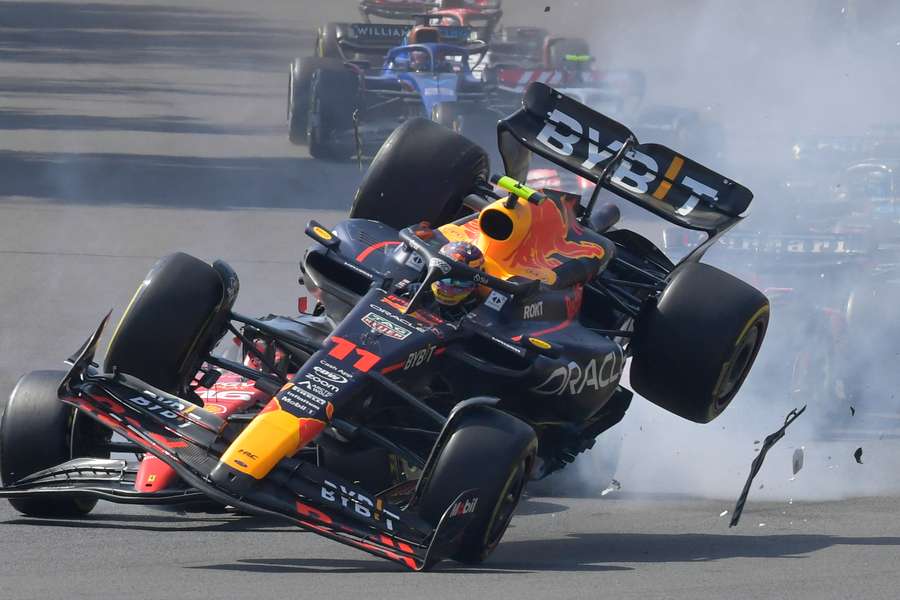 Red Bull Racing's Sergio Perez crashes with Ferrari's Charles Leclerc at the start of the Formula 1 Mexico Grand Prix