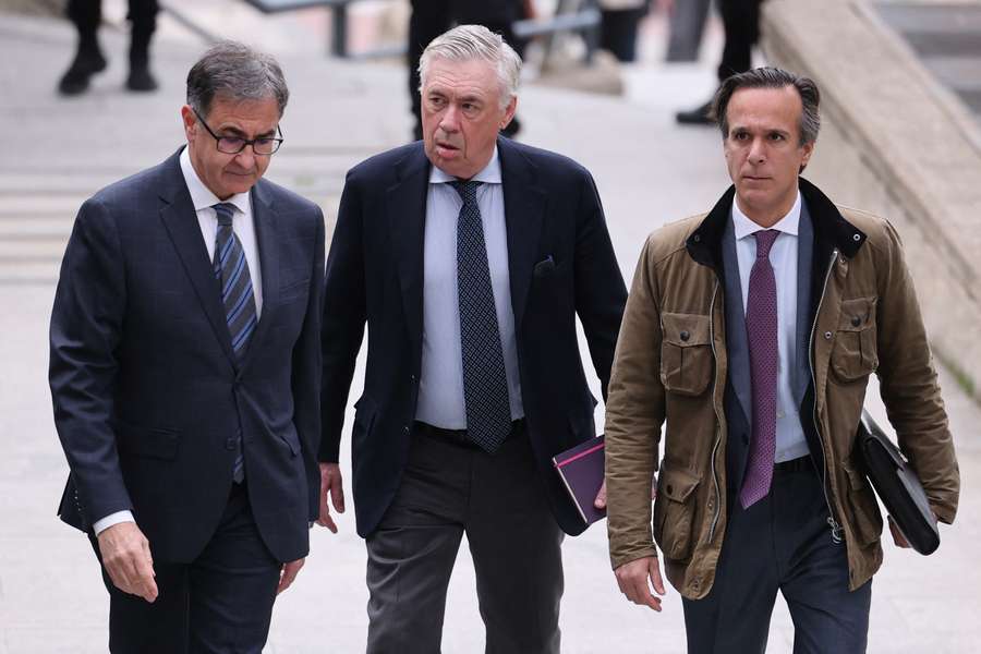 Real Madrid's coach Carlo Ancelotti (C) arrives at the High Court of Justice of Madrid to go on trial