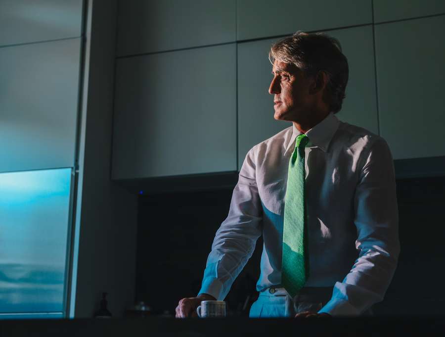 Roberto Mancini posing for a picture in an office in Rome, upon being named as the new coach of the Saudi Arabian national football team