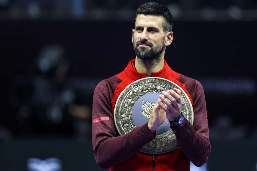 Novak Djokovic applauds with his trophy after winning the third-place match against Rafael Nadal in the "6 Kings Slam" tournament earlier this month